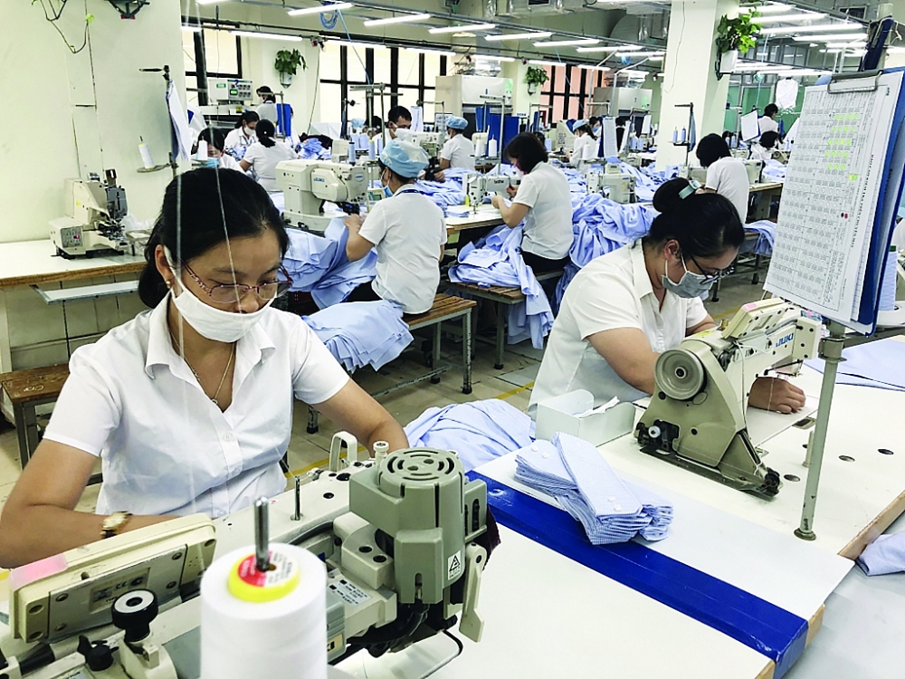 Nhiều DN dệt may đã có đơn hàng đến giữa năm 2021. 	Ảnh: H.Dịu